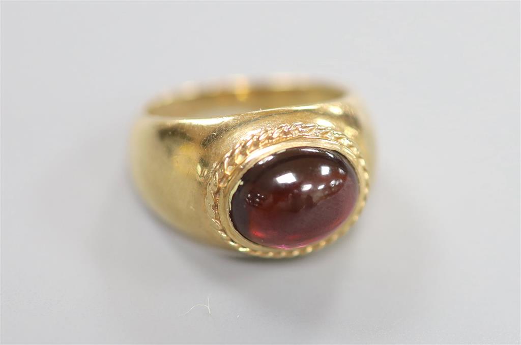 A 1970s Victorian style 9ct gold and cabochon garnet set dress ring, size I/J, gross 4.8 grams.